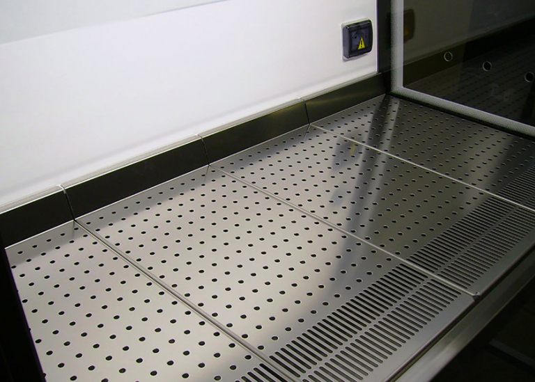 Biosafety cabinet with perforated work surface
